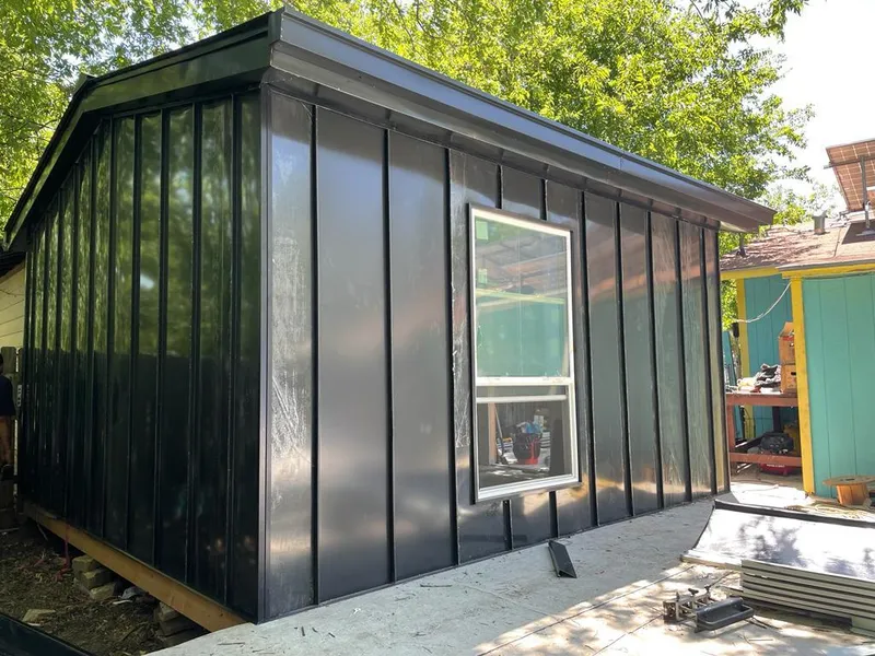 Black standing seam metal wall panels for Roof Inspection in Queensbury