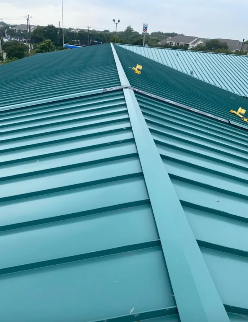 Green commercial metal roof ridge and valley for Metal Roof Repair in Queensbury